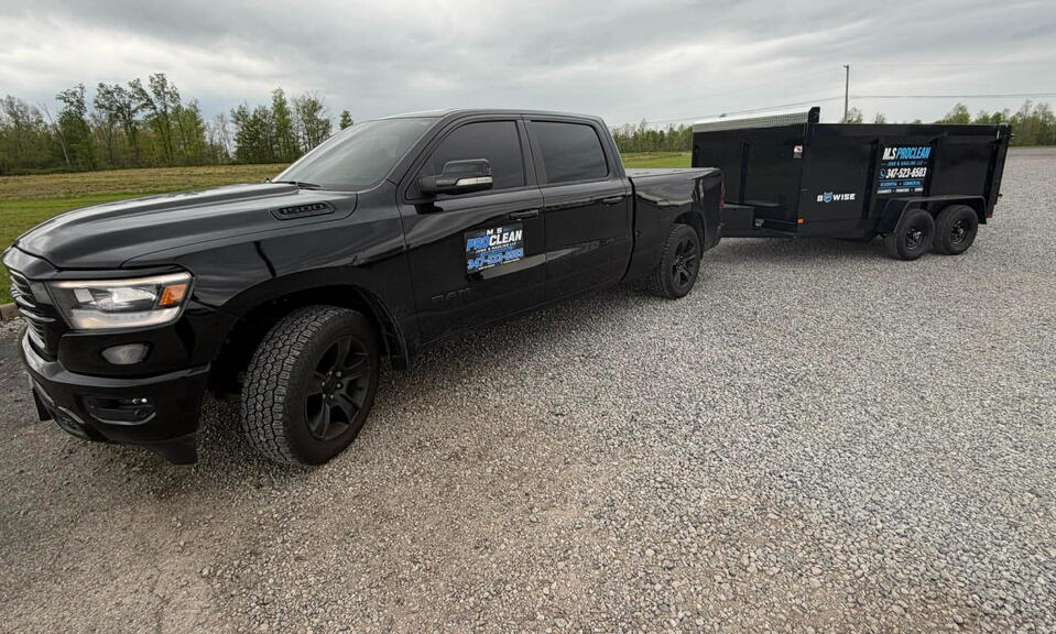 MS ProClean Junk Removal truck and dump trailer providing fast and reliable hauling service